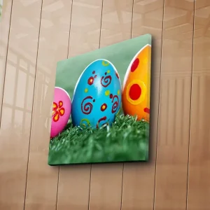 Canvastavla 45x45 cm - Färgglada påskägg i grön gräsmatta Blå / Rosa / Gul - Inredning Premium
