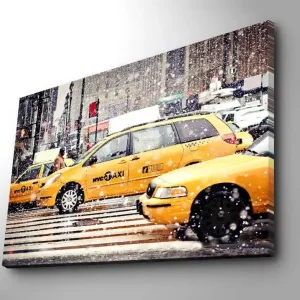 Canvastavla 70x100 cm - Livlig stadsbild med gula taxibilar som kör genom snöfall i New York City - Inredning & dekor Populär