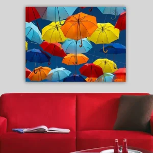Canvastavla 70x100 cm - Färgglada paraplyer som svävar i luften - Inredning & dekor Outlet