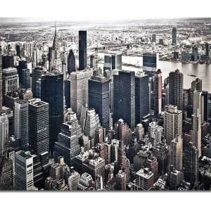 Canvastavla 70x100 cm - Panoramavy av en stad med höga skyskrapor och en livlig stadsbild - Inredning & dekor Nedsatt pris
