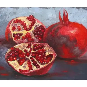 Canvastavla 70x100 cm - Två granatäpplen, ett helt och ett delat, som visar sina saftiga kärnor - Inredning & dekor Beställ idag