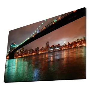 Premium Canvastavla 70x45 cm - Bro över en stad med reflektioner i vattnet Mörkgrön / Orange / Svart - Inredning