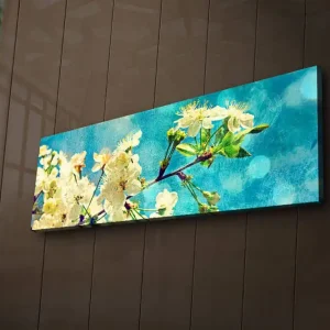 Expressleverans Canvastavla med LED-belysning 30x90 cm - Blommande körsbärsgrenar mot en ljusblå bakgrund Vit / Ljusblå / Grön - Inredning