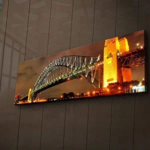 Kampanj Canvastavla med LED-belysning 30x90 cm - Sydney Harbour Bridge i kvällsbelysning Guld / Grön / Svart - Inredning