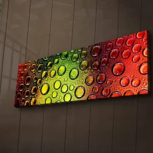 Canvastavla med LED-belysning 30x90 cm - Färgglad komposition av droppar på en yta Grön / Röd / Orange - Inredning Begränsat antal
