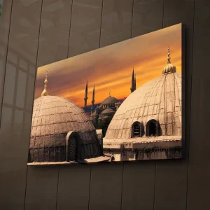 Canvastavla med LED-belysning 45x70 cm - Storslagen vy av moskéer med kupoler och minareter mot en färgsprakande solnedgång Guld / Grå / Orange - Inredning Fynd