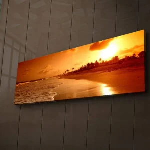 Canvastavla med LED-belysning 30x90 cm - Solnedgång över en strand med palmer i silhuett Orange / Guld / Brun - Inredning Bästa pris