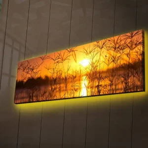 Begränsat antal Canvastavla med LED-belysning 30x90 cm - Solnedgång över en spegelblanka sjö med gräs i förgrunden Orange / Guld / Svart - Inredning