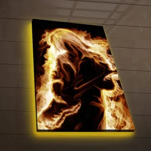 Lägg i varukorgen Canvastavla med LED-belysning 70x45 cm - Eldig silhuett av en gitarrist Guld / Orange / Svart - Inredning