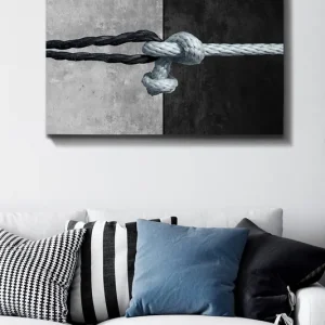 Beställ nu Canvastavla 70x100 cm - Knut av rep som förenar två kontrasterande ytor i svart och grått - Inredning & dekor