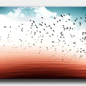 Canvastavla 70x100 cm - Flock av fåglar som flyger över en stilla vattenyta i en harmonisk färgskala - Inredning & dekor Begränsad tid